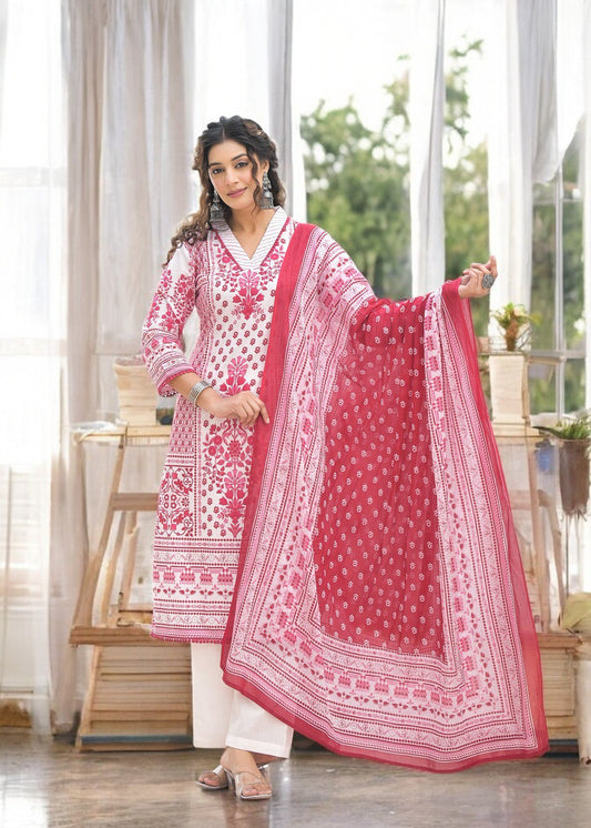 Woman wearing a white and pink printed chicken work suit with a matching dupatta and churidar pants
Smiling woman wearing a three-quarter sleeve white kurta with pink floral or paisley print and subtle chicken work embroidery, paired with white churidar pants and a matching printed dupatta