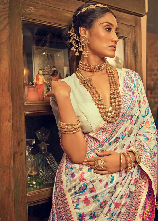 Woman in traditional attire with jewelry in a decorated room